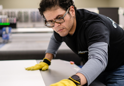 Large format print shop worker