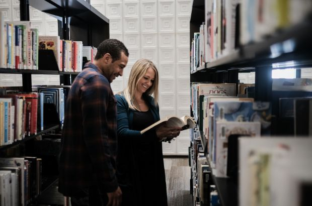 Two people researching at the Librabry