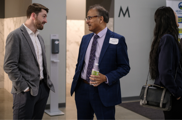 Chamber & Board members talking at an event