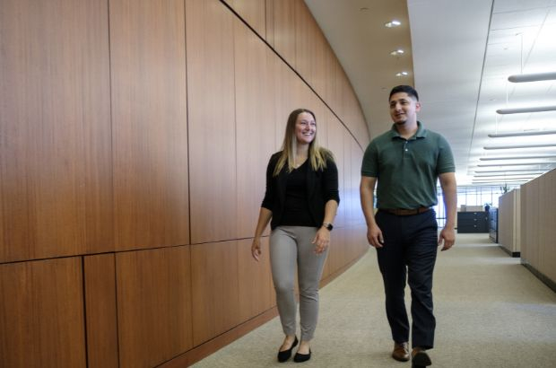 Modern woodmen employees walking down the hall