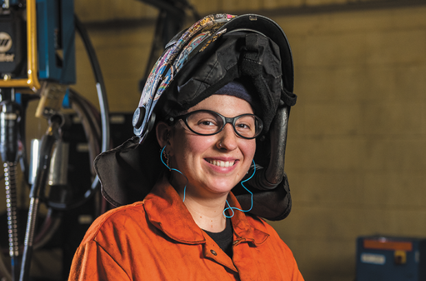 John Deere Employee in orange coveralls